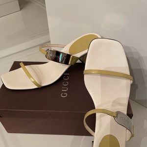 Gucci sandals,citrus straps with Gucci metal insignia . Med. wear, soles only.